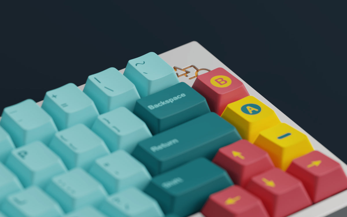 GMK Retrocast keycaps in mint and teal with red and yellow A and B novelty keys