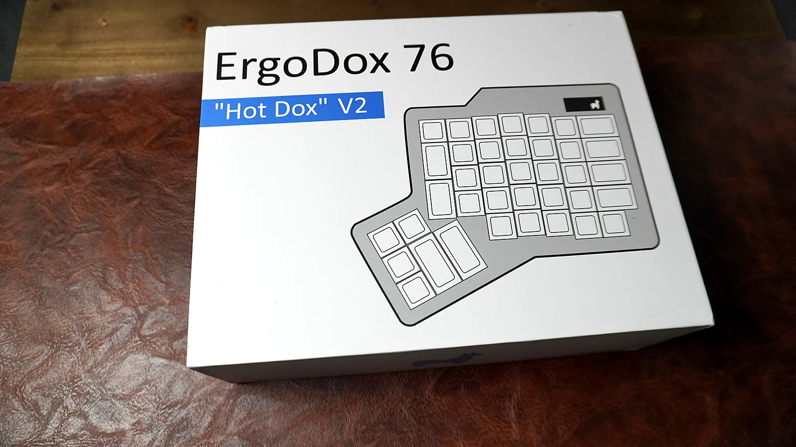ErgoDox 76 Hot Dox V2 retail box with the split keyboard outline on the lid