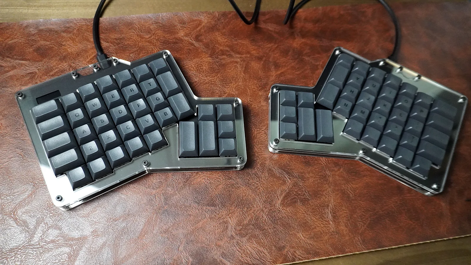 ErgoDox 76 Hot Dox V2 set up on a desk with both halves cabled