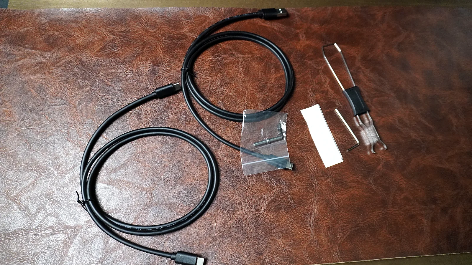 ErgoDox 76 Hot Dox V2 accessories: two USB-C cables, a switch and keycap puller, and small spare parts